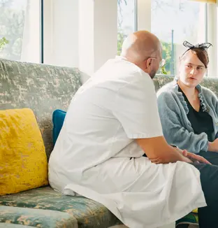 A staff member in discussion with a patient