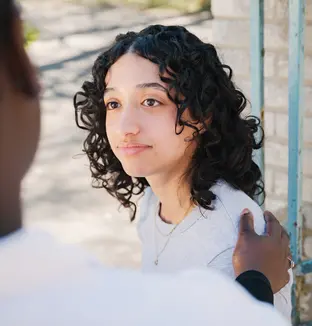 A staff member in discussion with a patient